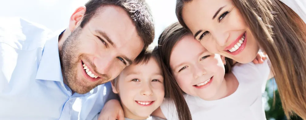 A smiling family of four